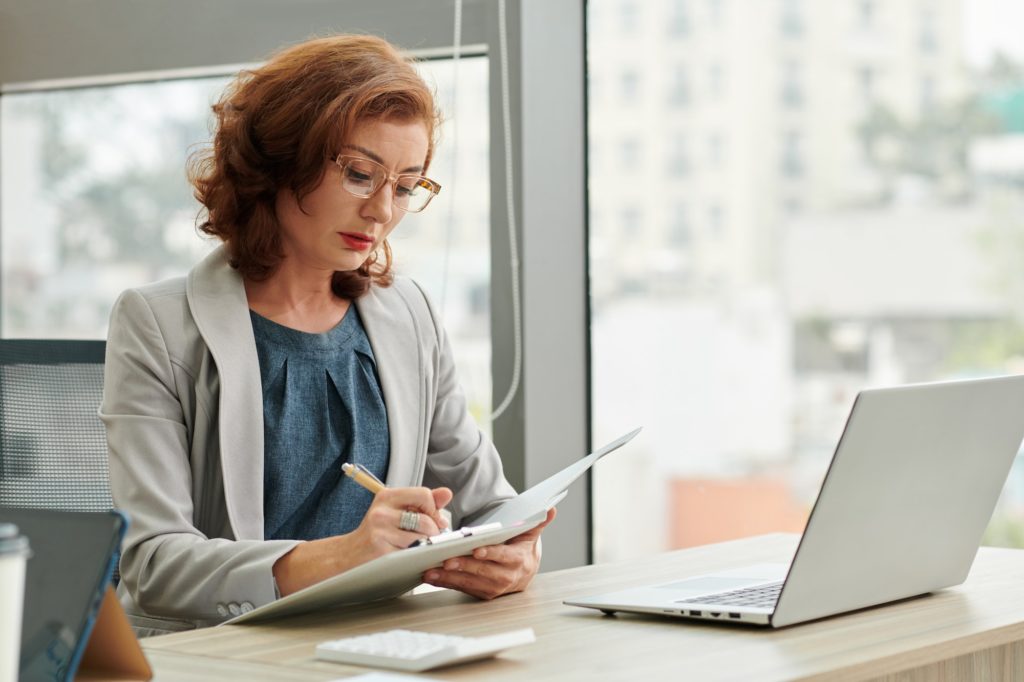 Businesswoman Checking Documents