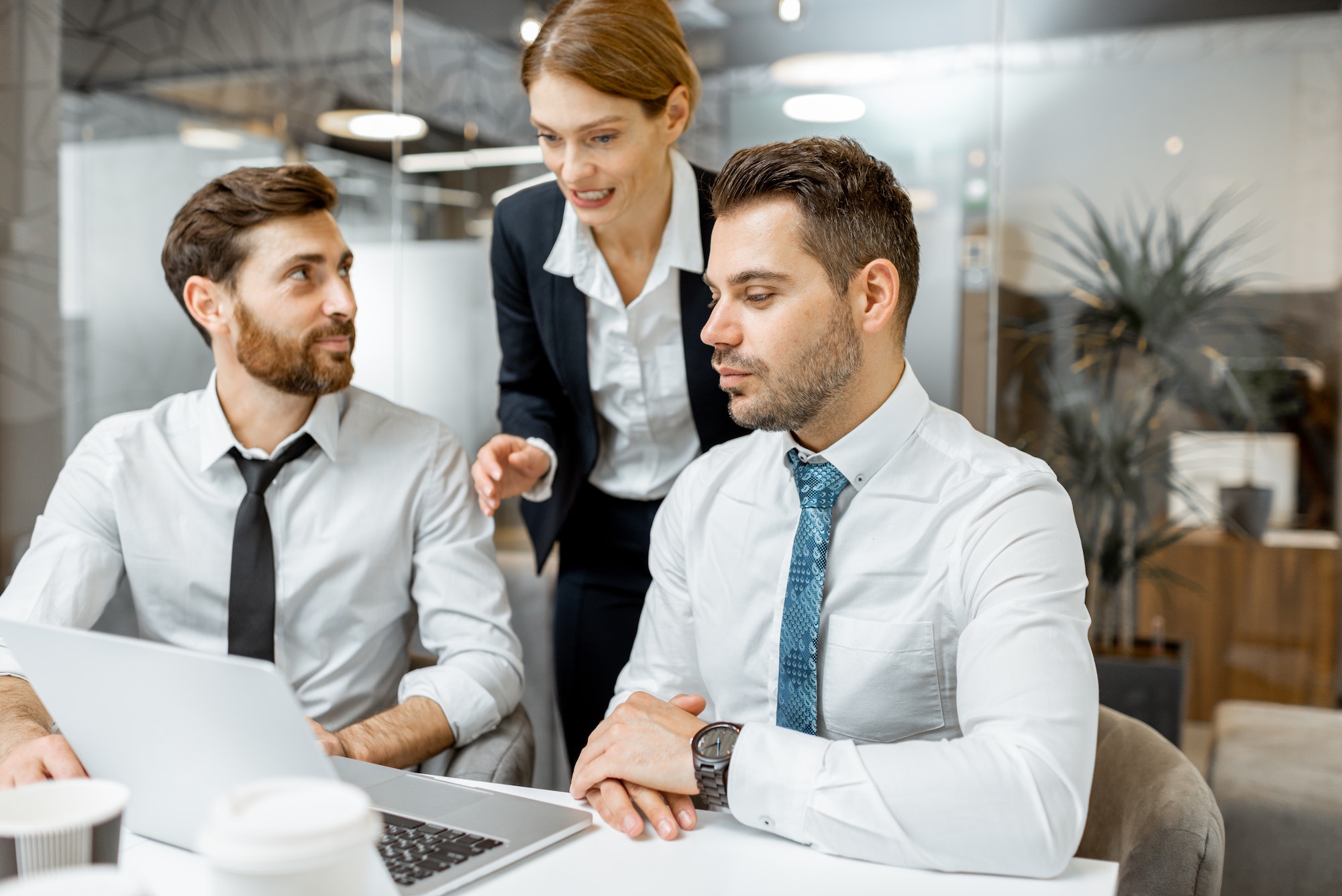 Team leader with employees in the office